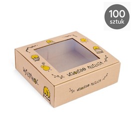 Duża ekspozycja 100 pudełek ustawionych w kilku warstwach; okienka skierowane do aparatu, delikatne akcenty wielkanocne w tle.